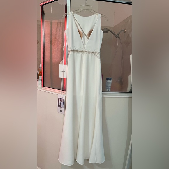 Pronovias Alaia is a striking crepe wedding dress featuring linear beading. - Picture 9 of 11